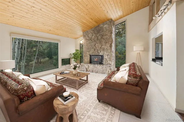 a bed room with a fireplace and a balcony