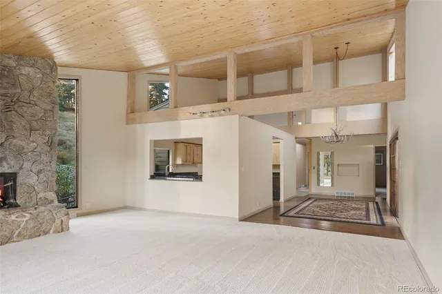 a kitchen with stainless steel appliances granite countertop a stove and a microwave