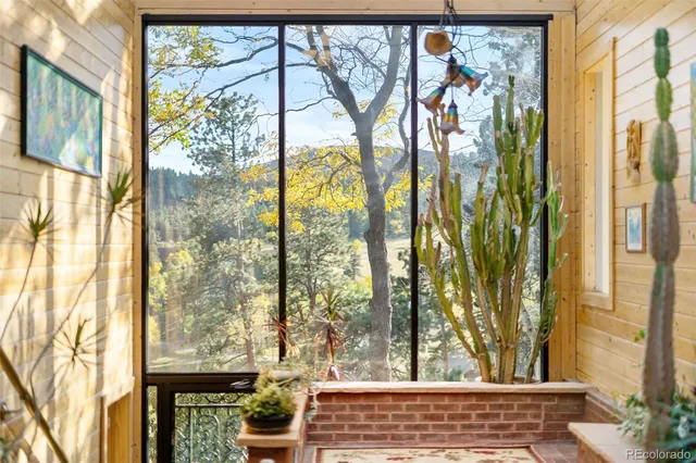 a front view of a house with outdoor seating