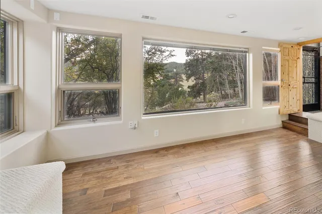 a view of a bathtub in a room next to a window