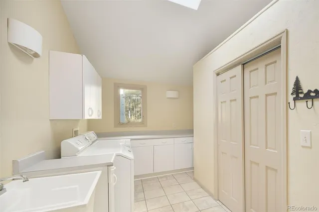 a view of a town with trees and mountains