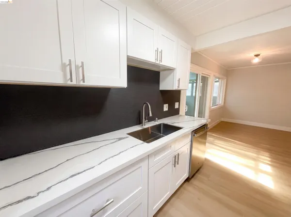 a kitchen with a sink and a stove