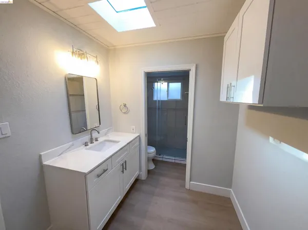 a bathroom with a double vanity sink and mirror