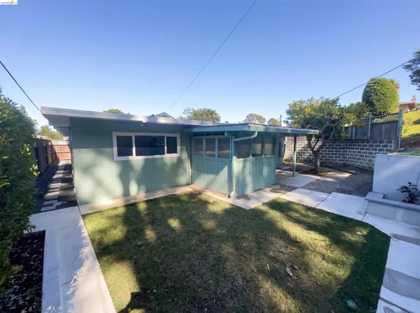 a view of a house with swimming pool