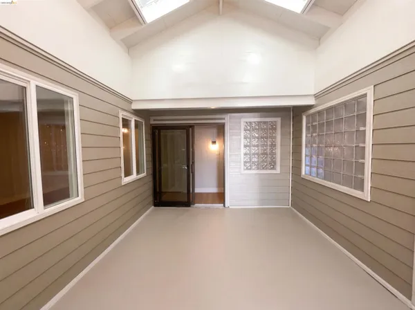 a view of an empty room with a window