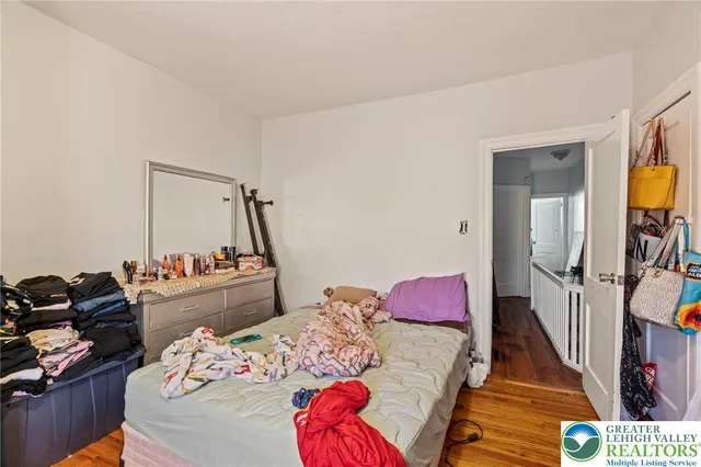 a bedroom with a bed and a couch