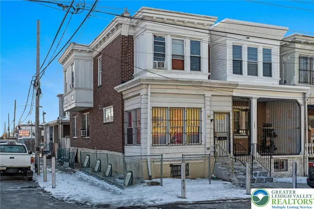a front view of a building with glass windows