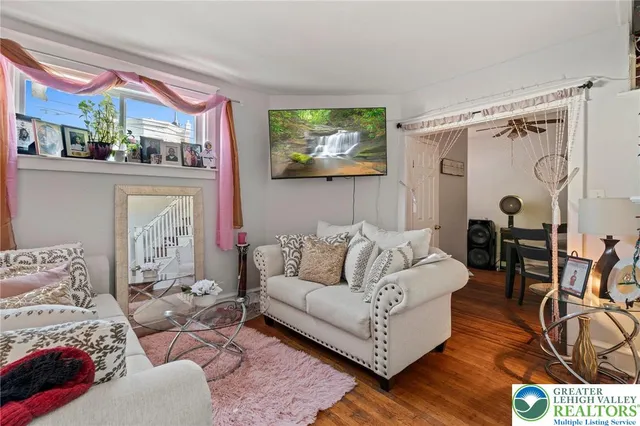 a living room with furniture and a large window
