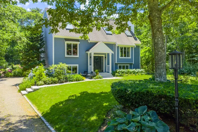 a front view of a house with a yard