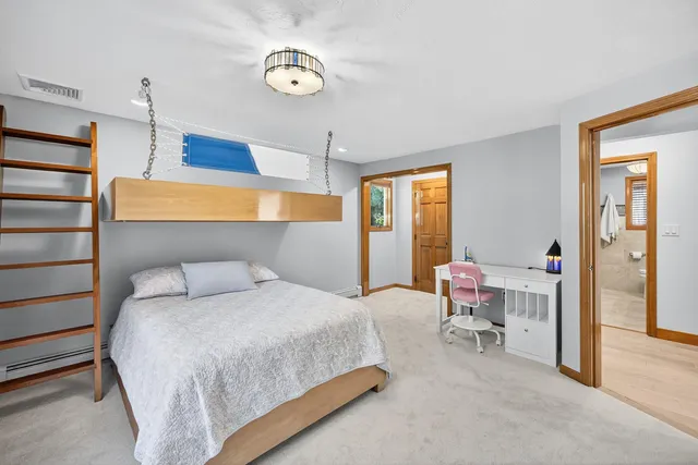 a view of staircase with railing and white walls