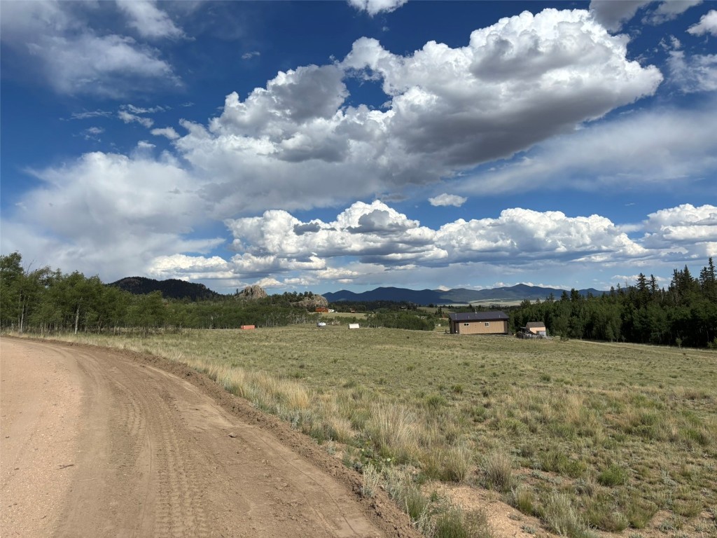 702 Pinto Trail Como, CO 80432 - Photo 12 of 20 a view of a lake with a big yard