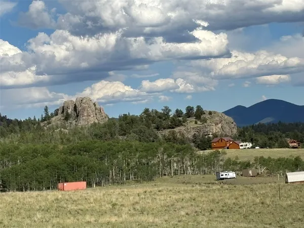 a view of a town with mountains in the background