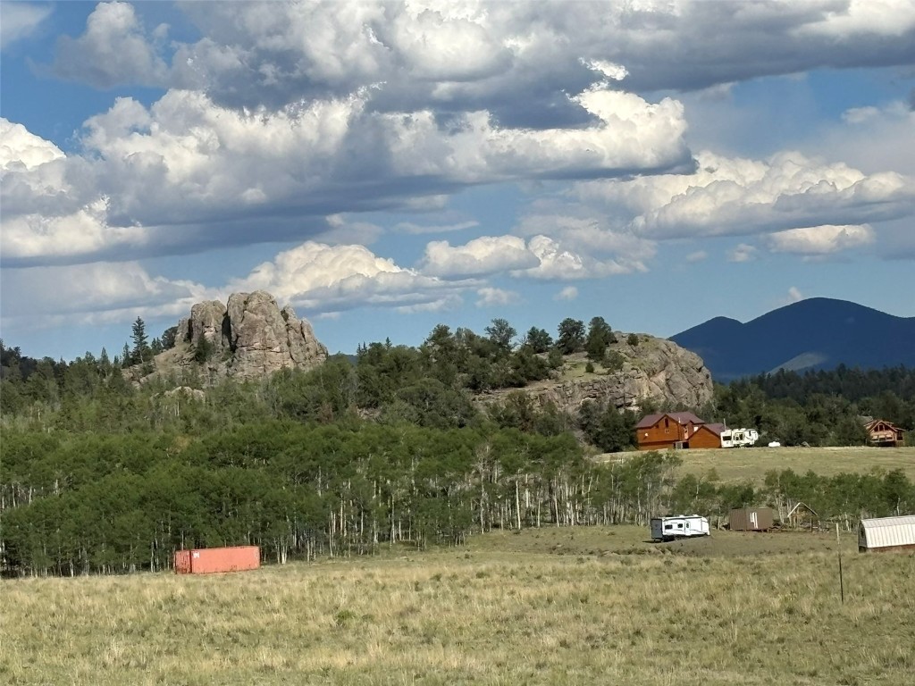 702 Pinto Trail Como, CO 80432 - Photo 4 of 20 a view of a town with mountains in the background