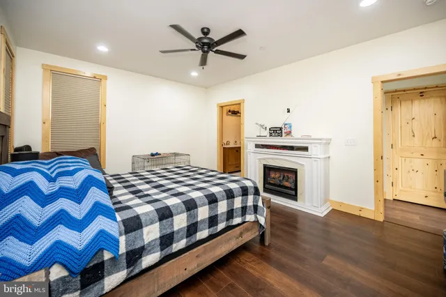 a bedroom with a bed and a fireplace