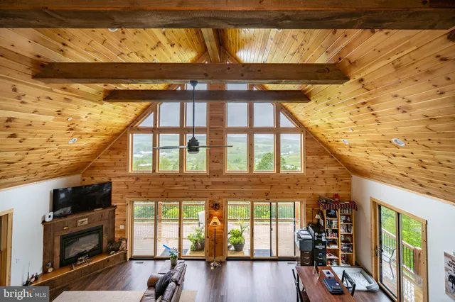 a view of a porch with furniture and a flat screen tv