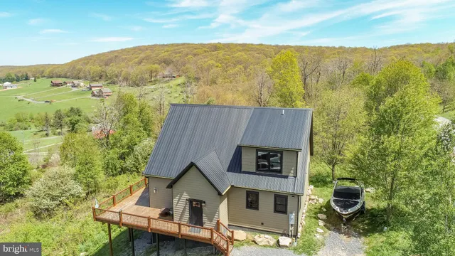a view of a small house with a garden
