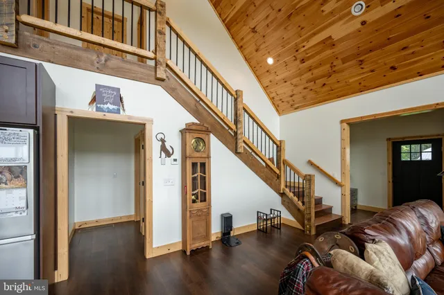 a view of entryway with wooden floor and stairs