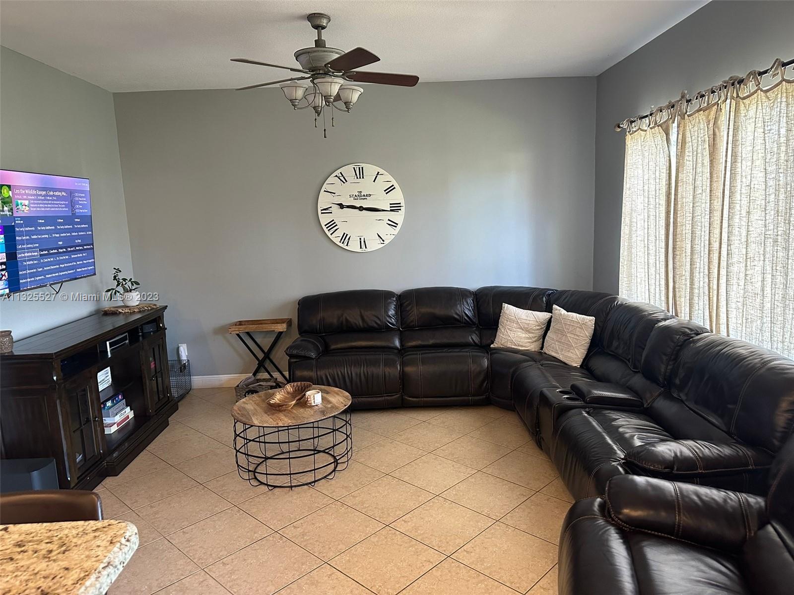 20565 Southwest 326th Street Homestead, FL 33030 - Photo 11 of 28 a living room with furniture a window and a couch