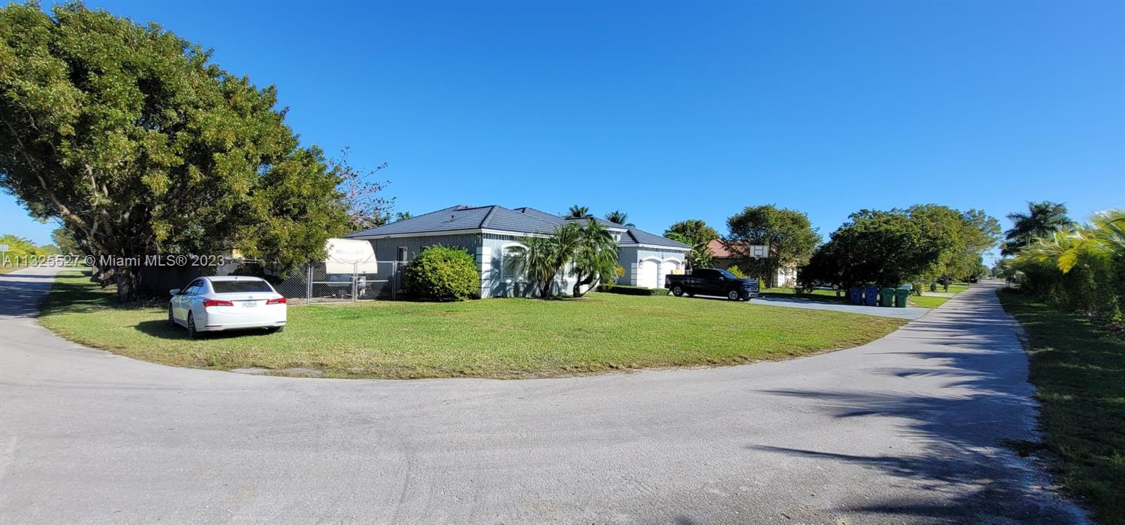 20565 Southwest 326th Street Homestead, FL 33030 - Photo 27 of 28 a view of a house with backyard and garden