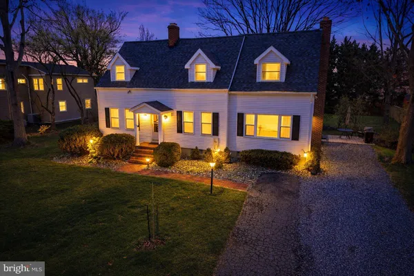 a view of a brick house with a yard