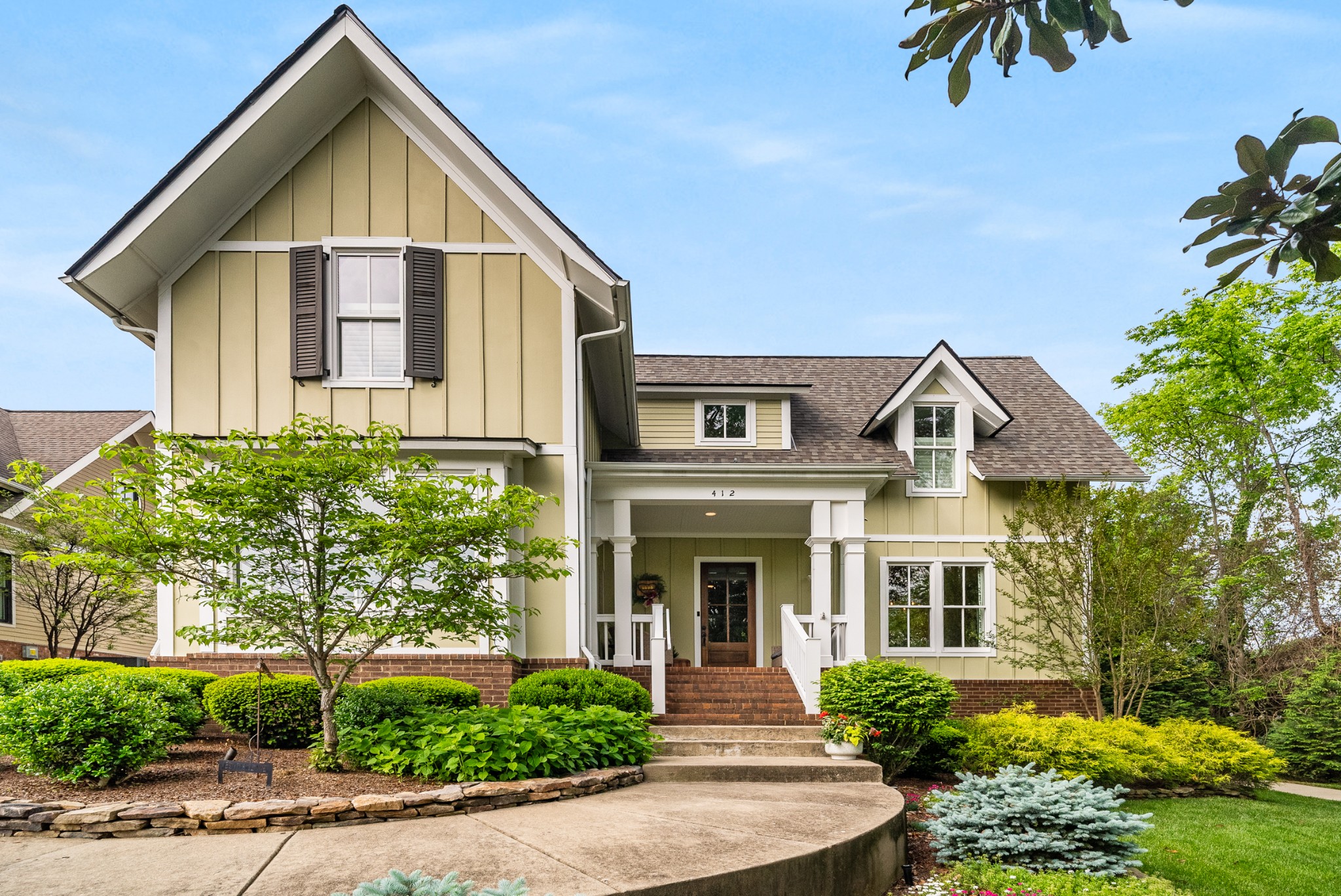 412 Boyd Mill Avenue Franklin, TN 37064 - Photo 1 of 53 a front view of a house with a yard