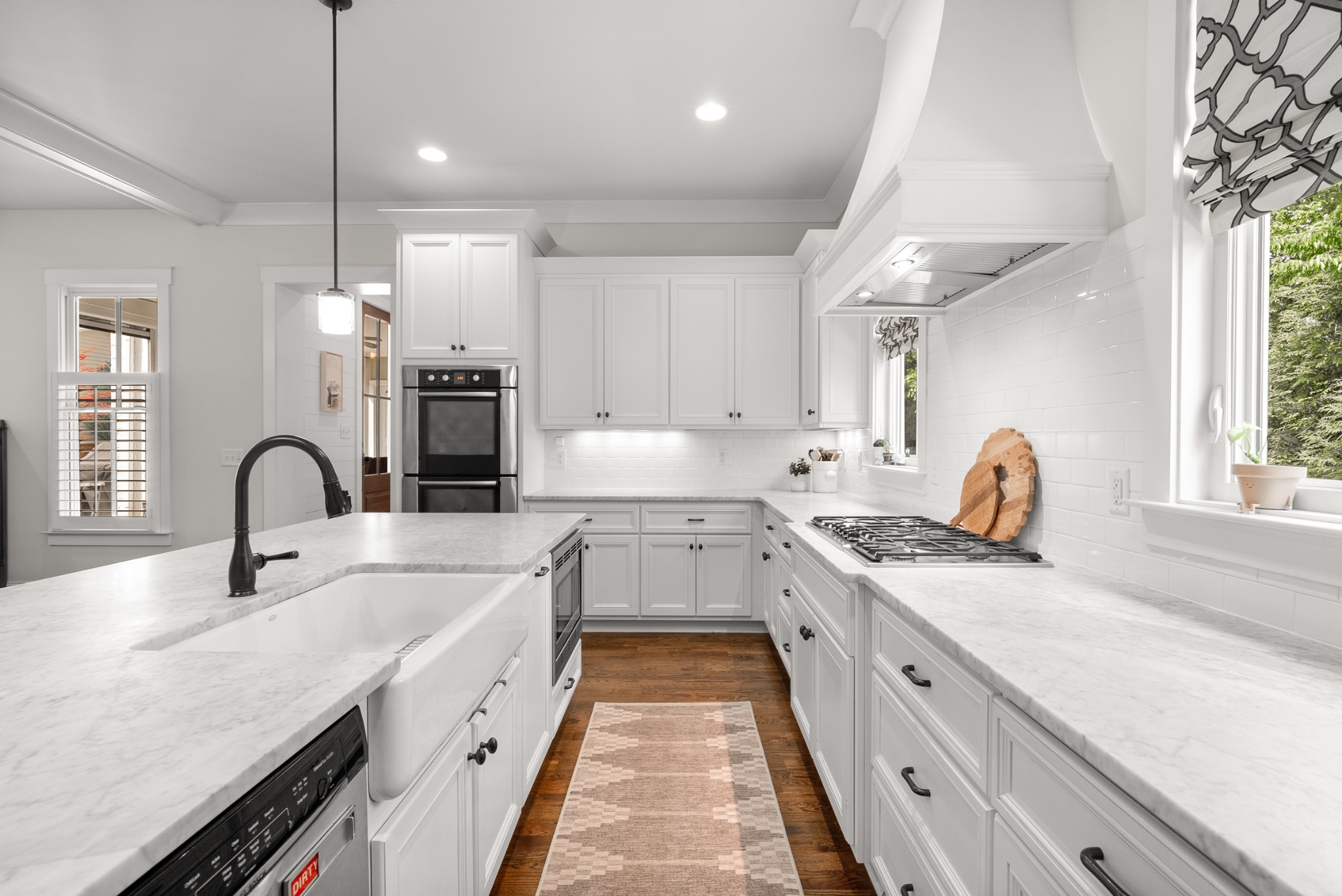 412 Boyd Mill Avenue Franklin, TN 37064 - Photo 12 of 53 a kitchen with granite countertop a sink a counter space appliances and cabinets