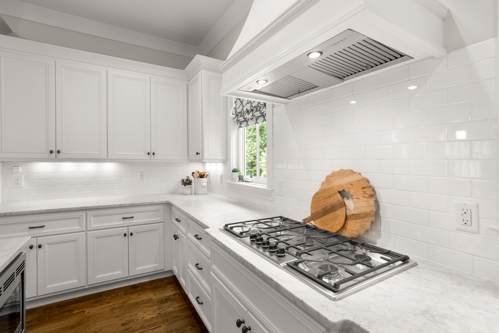 412 Boyd Mill Avenue Franklin, TN 37064 - Photo 13 of 53 a kitchen with white cabinets and appliances