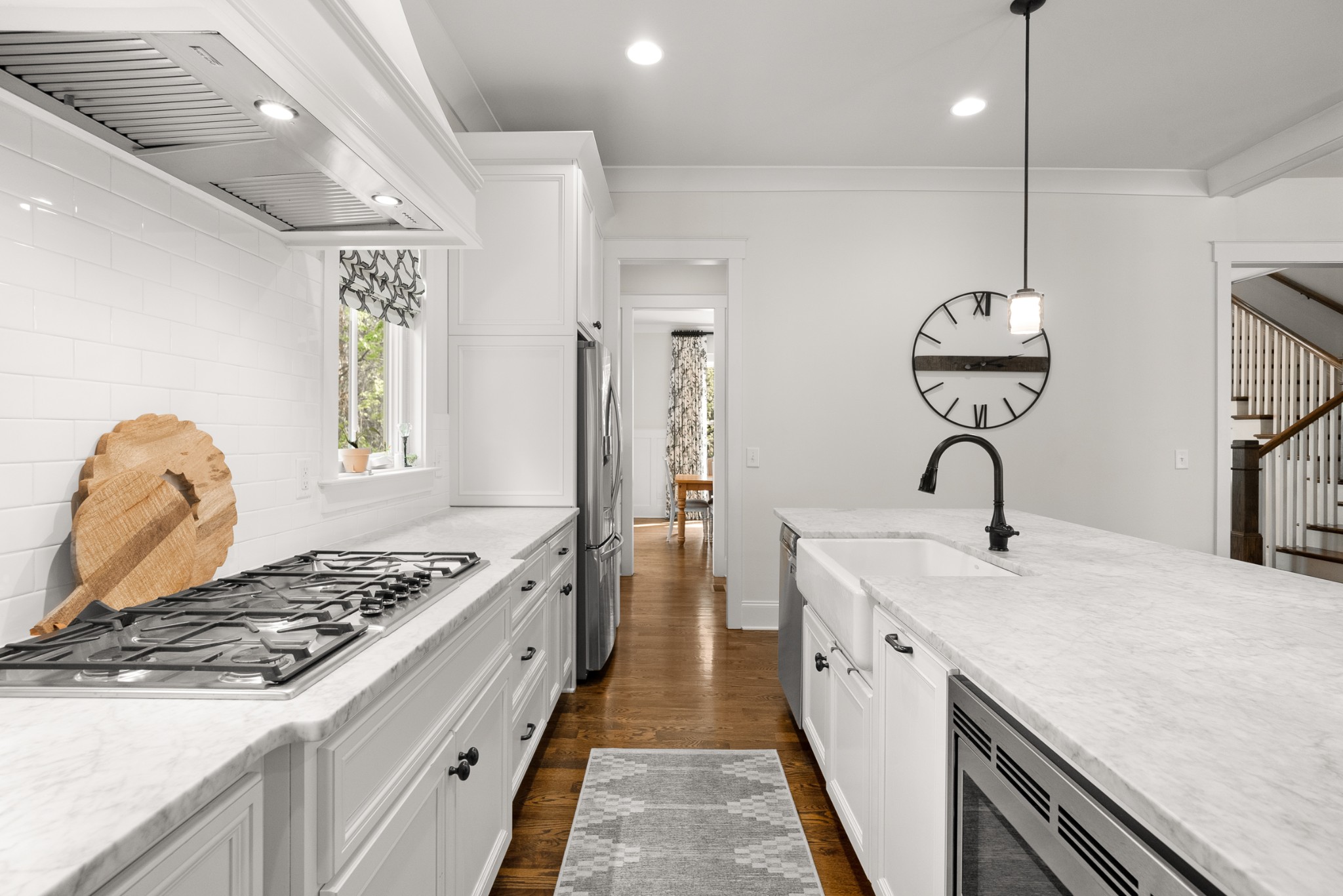 412 Boyd Mill Avenue Franklin, TN 37064 - Photo 14 of 53 a kitchen with stainless steel appliances granite countertop a sink stove and refrigerator