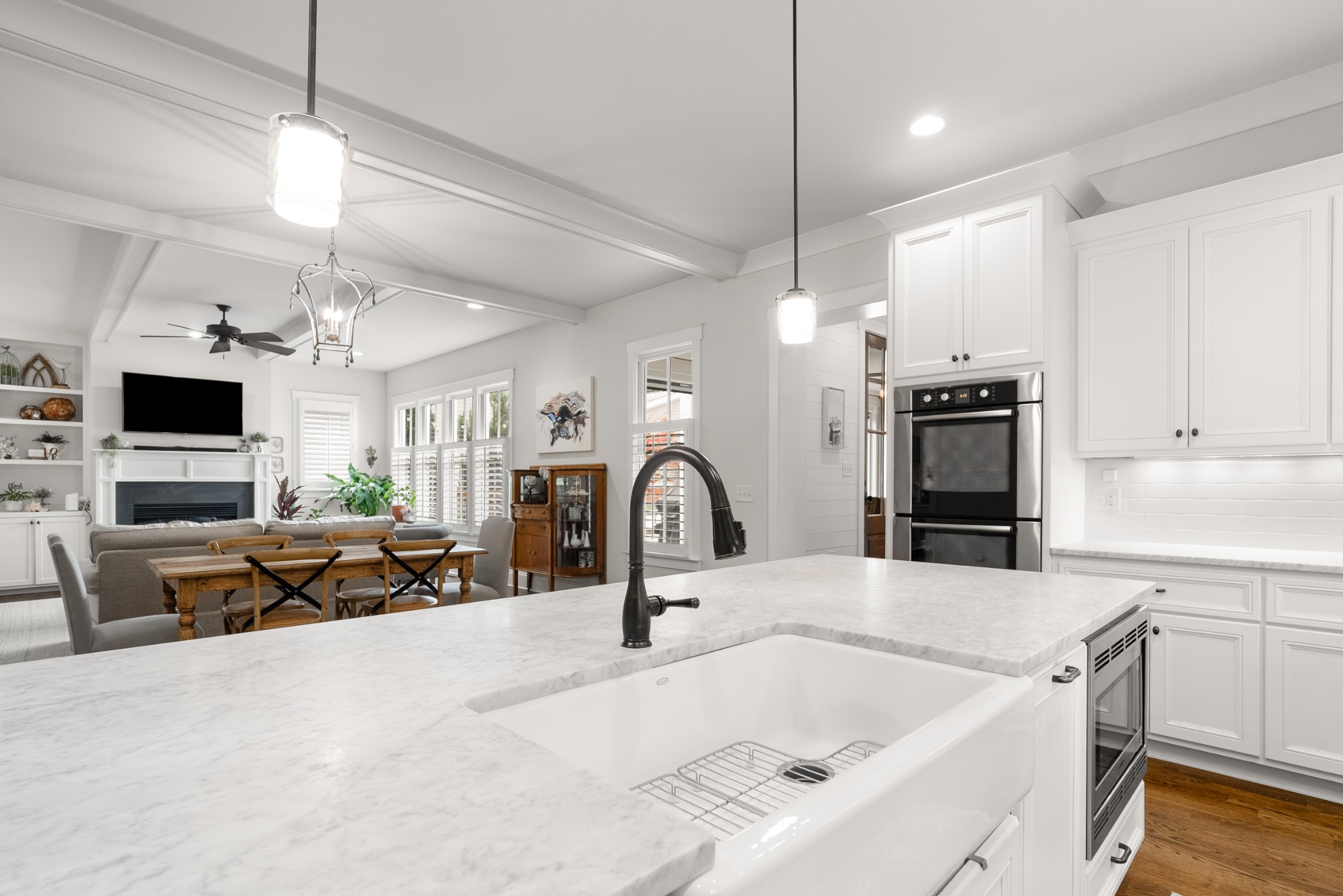 412 Boyd Mill Avenue Franklin, TN 37064 - Photo 15 of 53 a kitchen with kitchen island a sink appliances and a counter top space