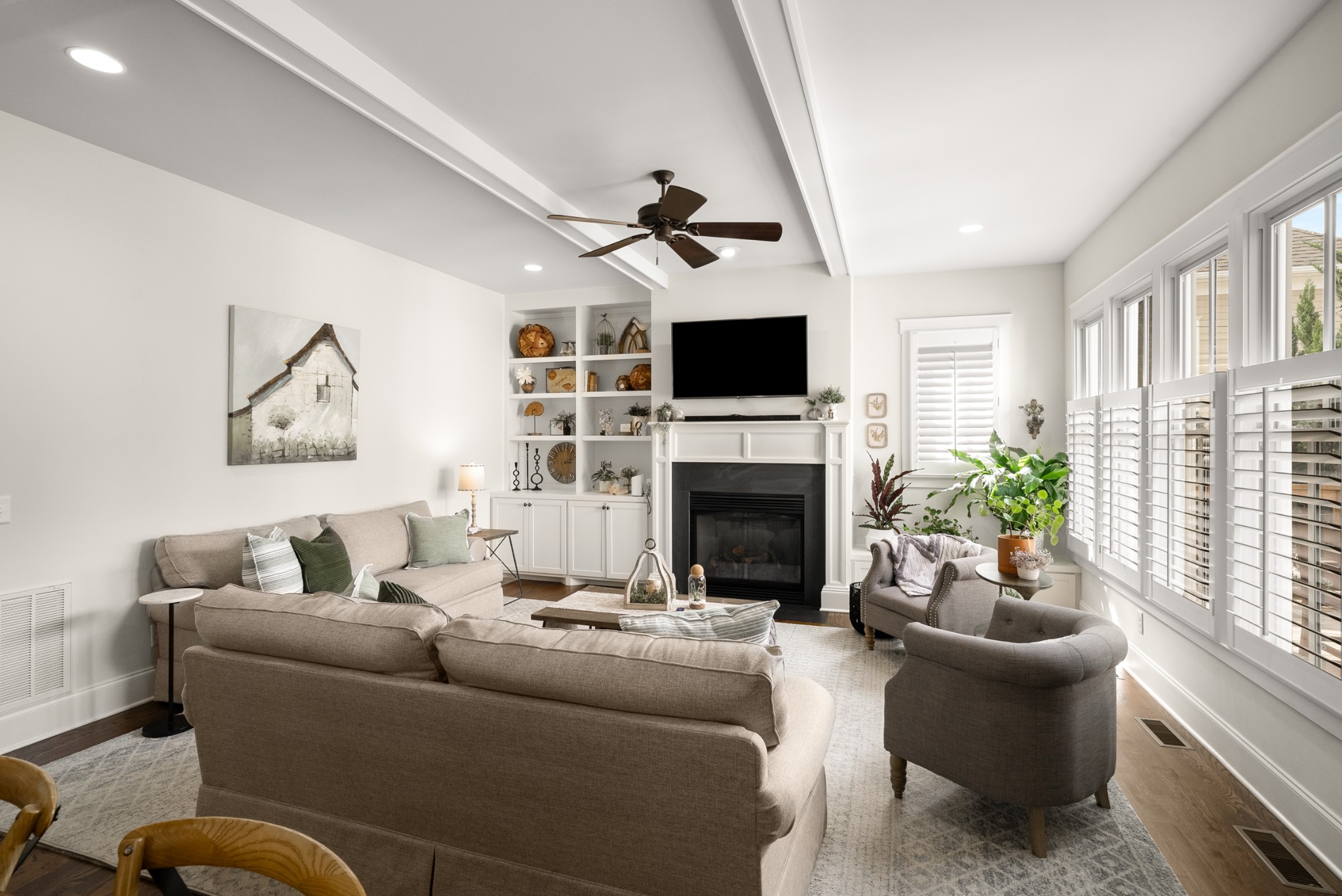 412 Boyd Mill Avenue Franklin, TN 37064 - Photo 19 of 53 a living room with furniture a fireplace and a flat screen tv