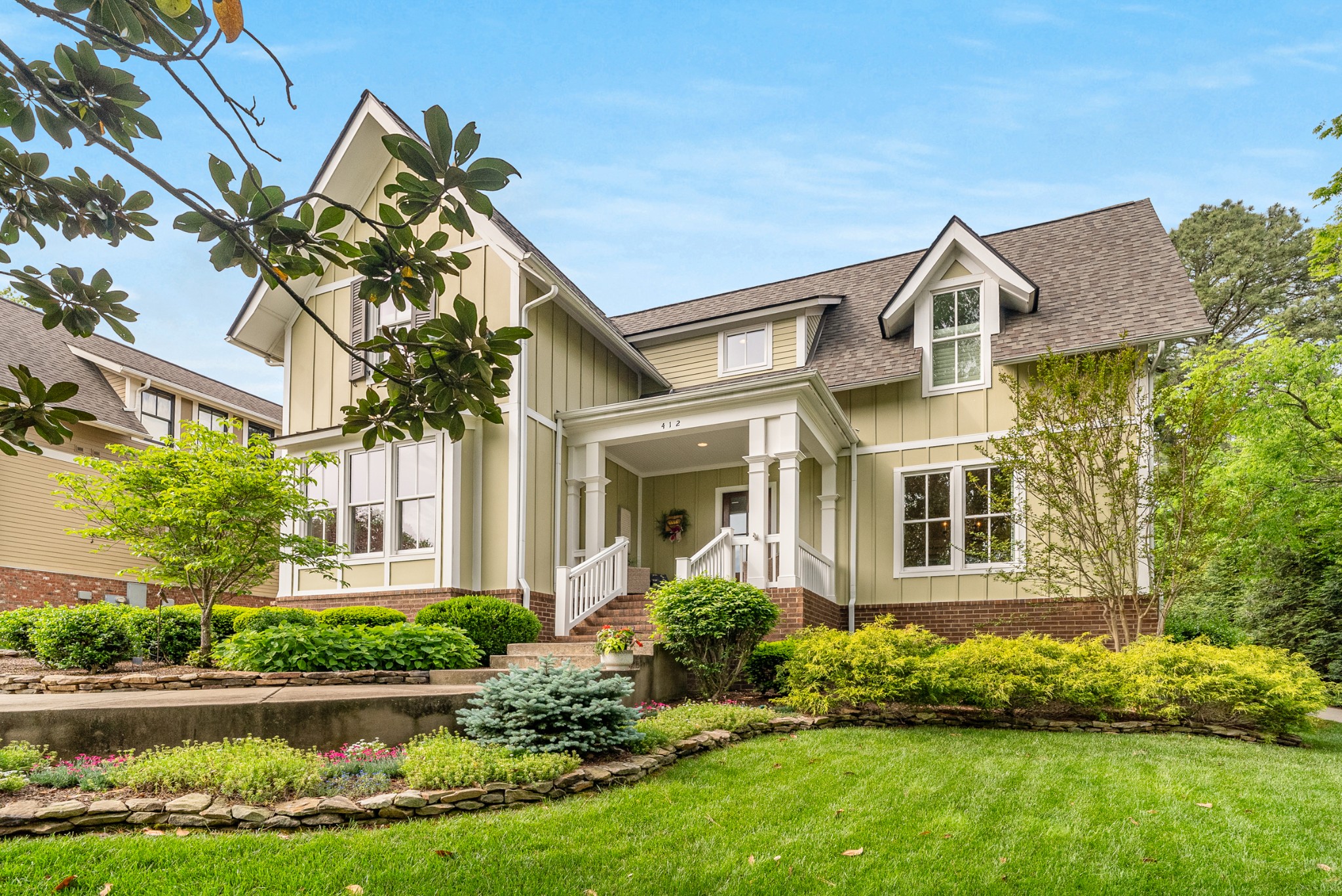 412 Boyd Mill Avenue Franklin, TN 37064 - Photo 2 of 53 a front view of a house with a yard and potted plants