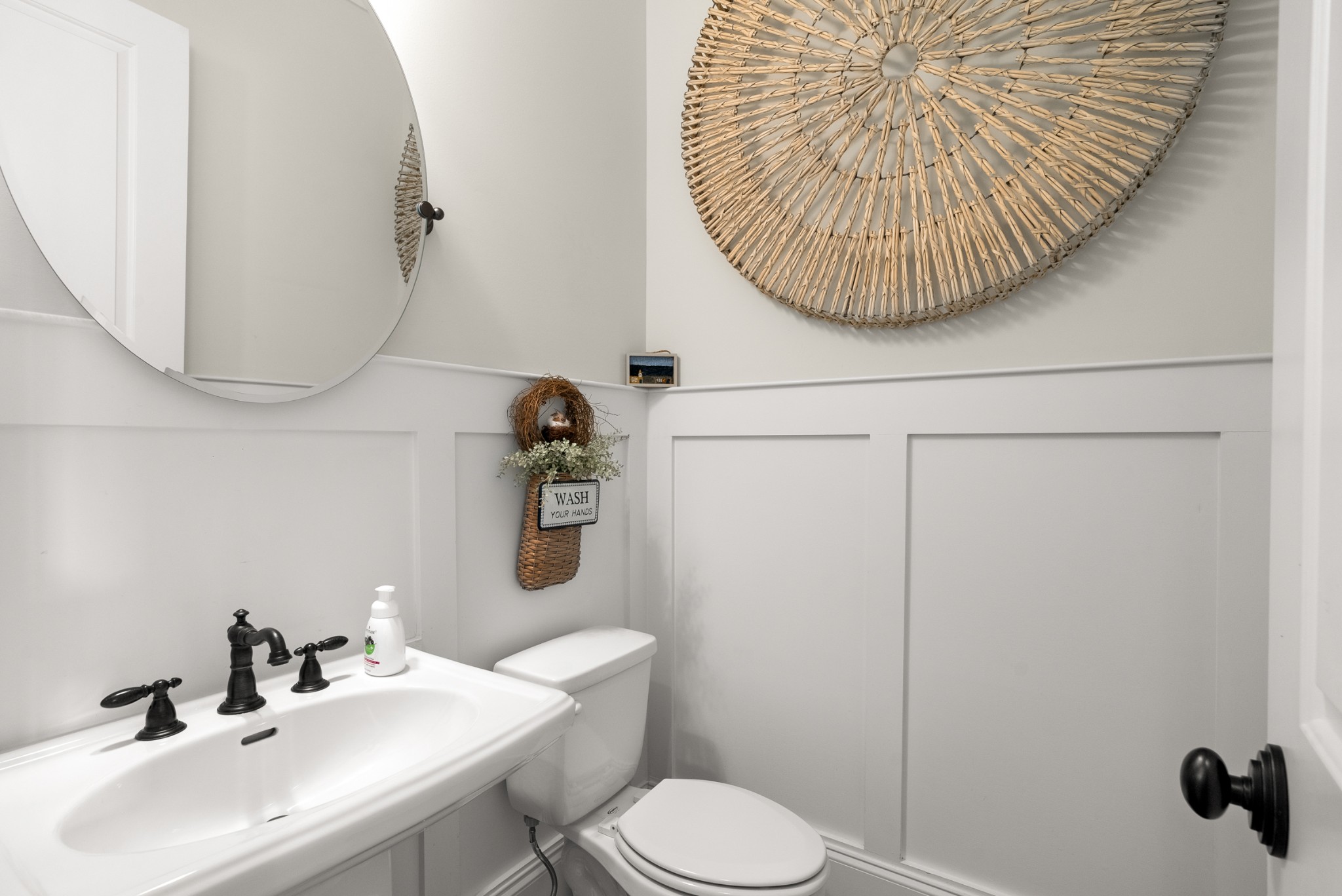 412 Boyd Mill Avenue Franklin, TN 37064 - Photo 28 of 53 a bathroom with a sink and mirror with toilet
