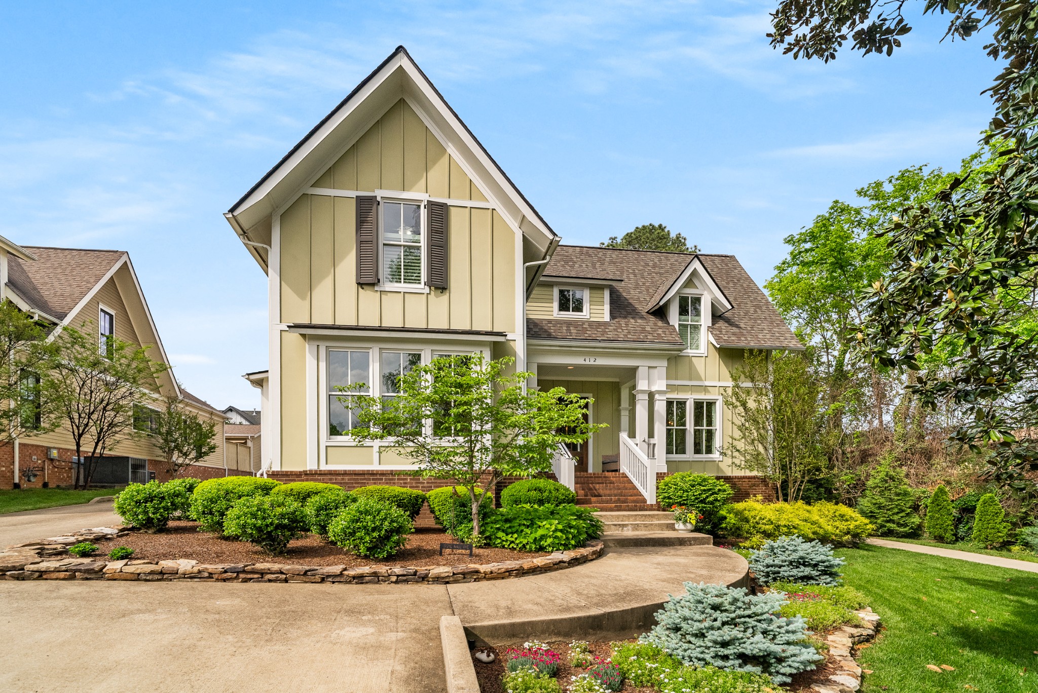 412 Boyd Mill Avenue Franklin, TN 37064 - Photo 3 of 53 a front view of a house with a yard and potted plants