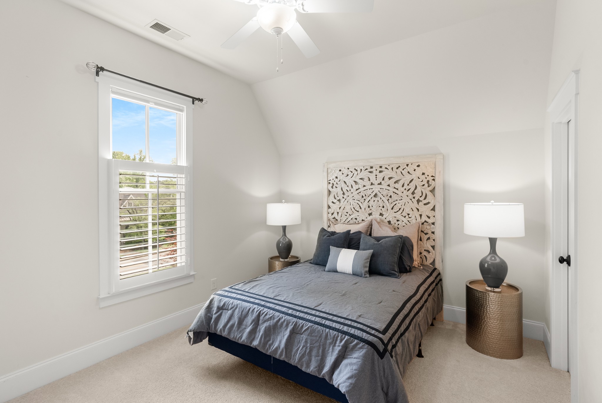412 Boyd Mill Avenue Franklin, TN 37064 - Photo 34 of 53 a bedroom with a bed and a lamp with a large window