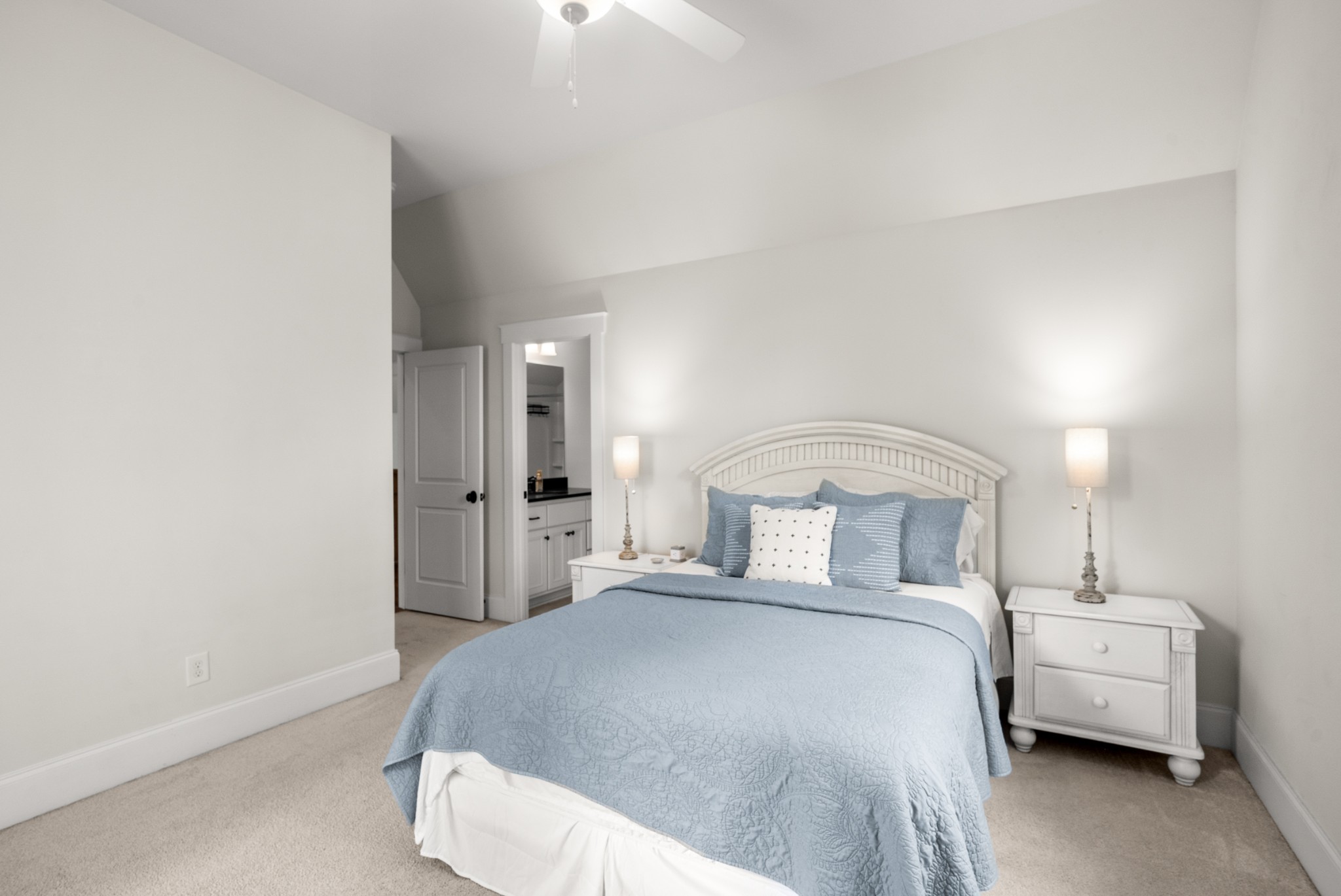 412 Boyd Mill Avenue Franklin, TN 37064 - Photo 38 of 53 a bedroom with a bed and a lamp