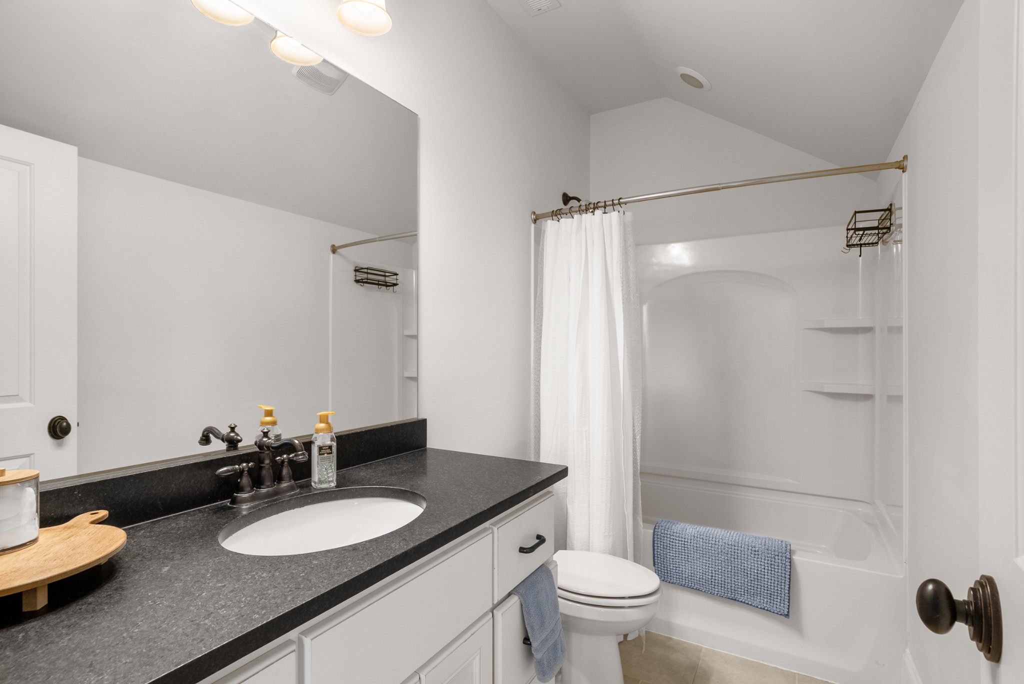 412 Boyd Mill Avenue Franklin, TN 37064 - Photo 41 of 53 a bathroom with a double vanity sink toilet and a mirror