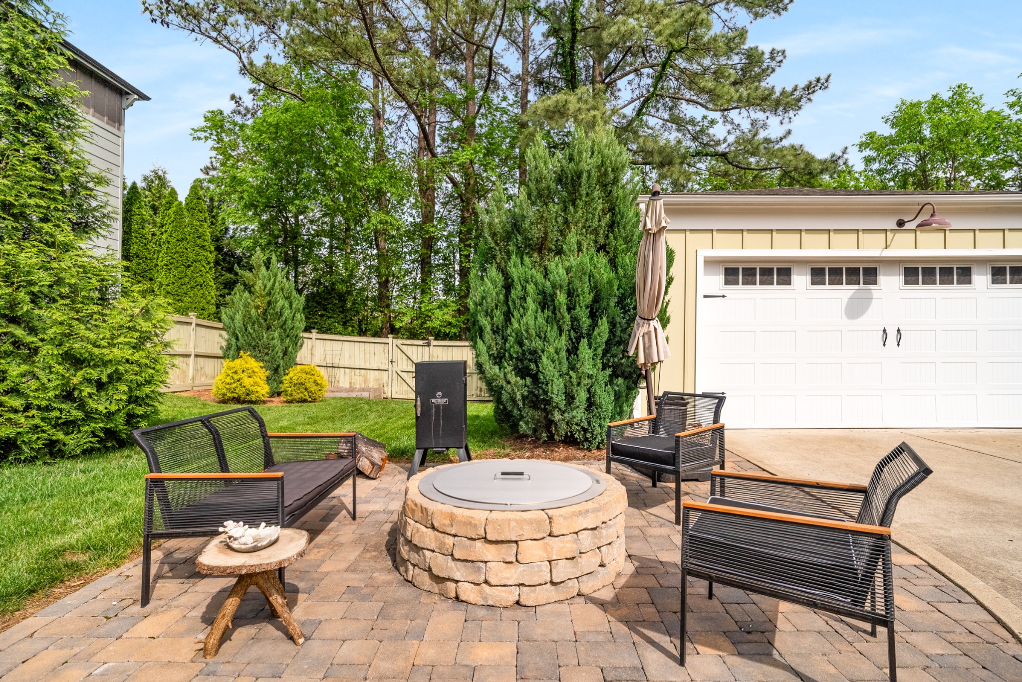 412 Boyd Mill Avenue Franklin, TN 37064 - Photo 47 of 53 a view of a chairs and table in the back yard of the house