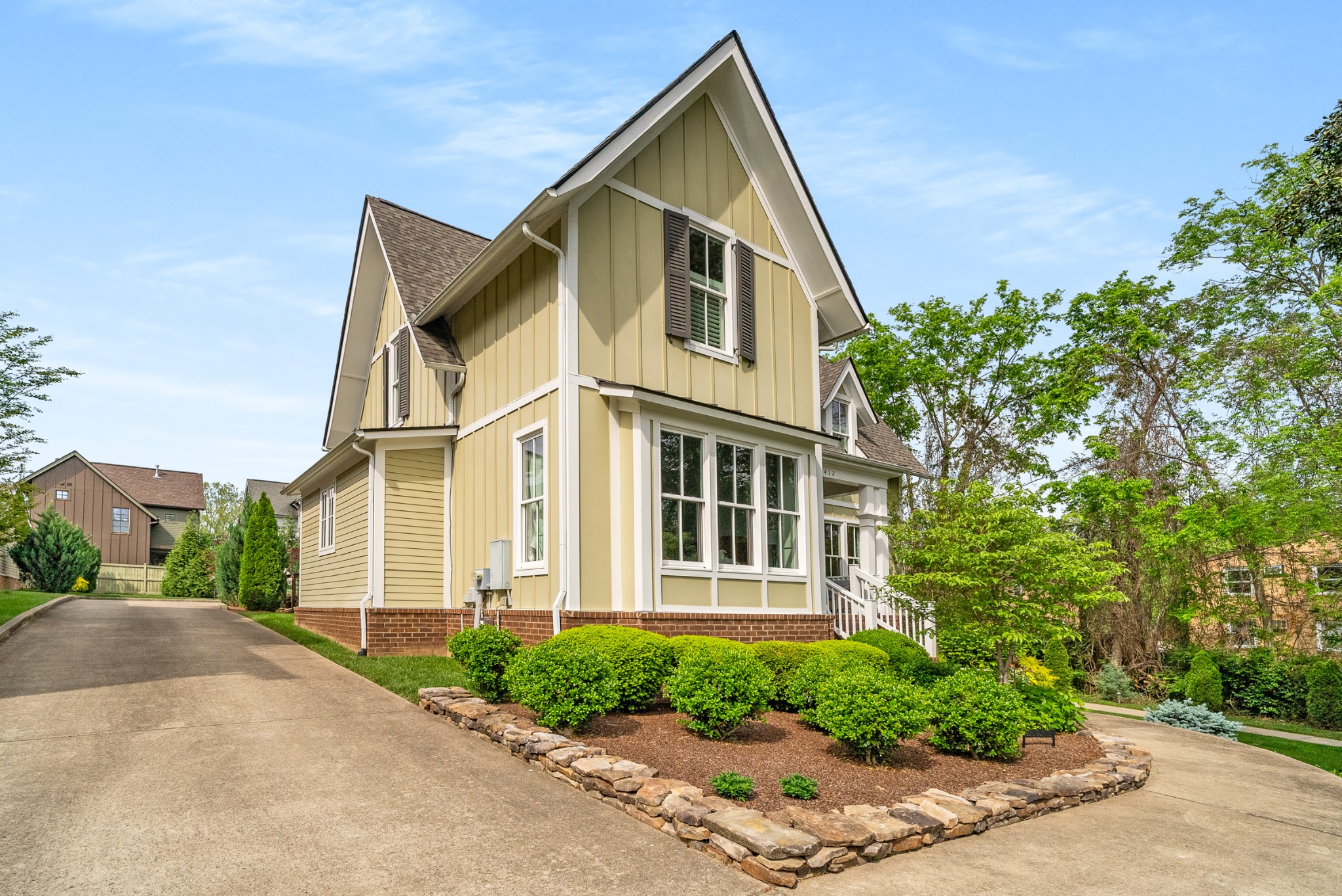 412 Boyd Mill Avenue Franklin, TN 37064 - Photo 5 of 53 a front view of a house with a yard and trees