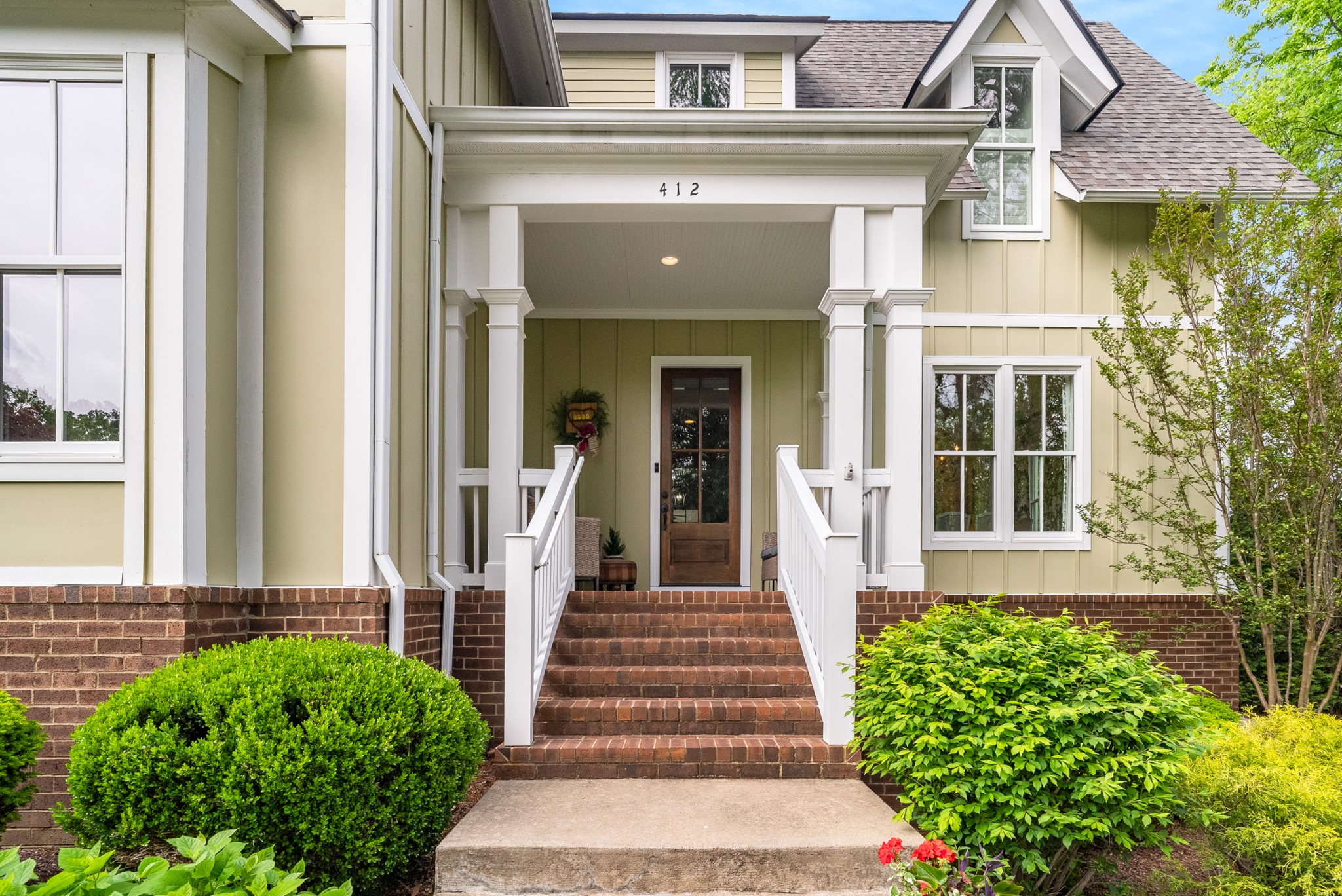 412 Boyd Mill Avenue Franklin, TN 37064 - Photo 6 of 53 a front view of a house with a garden