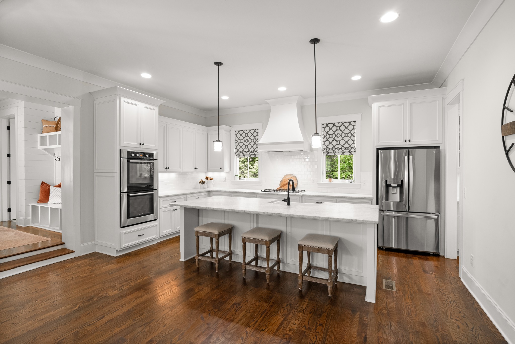 412 Boyd Mill Avenue Franklin, TN 37064 - Photo 10 of 53 a kitchen with stainless steel appliances granite countertop a sink a stove a refrigerator and island with wooden floor