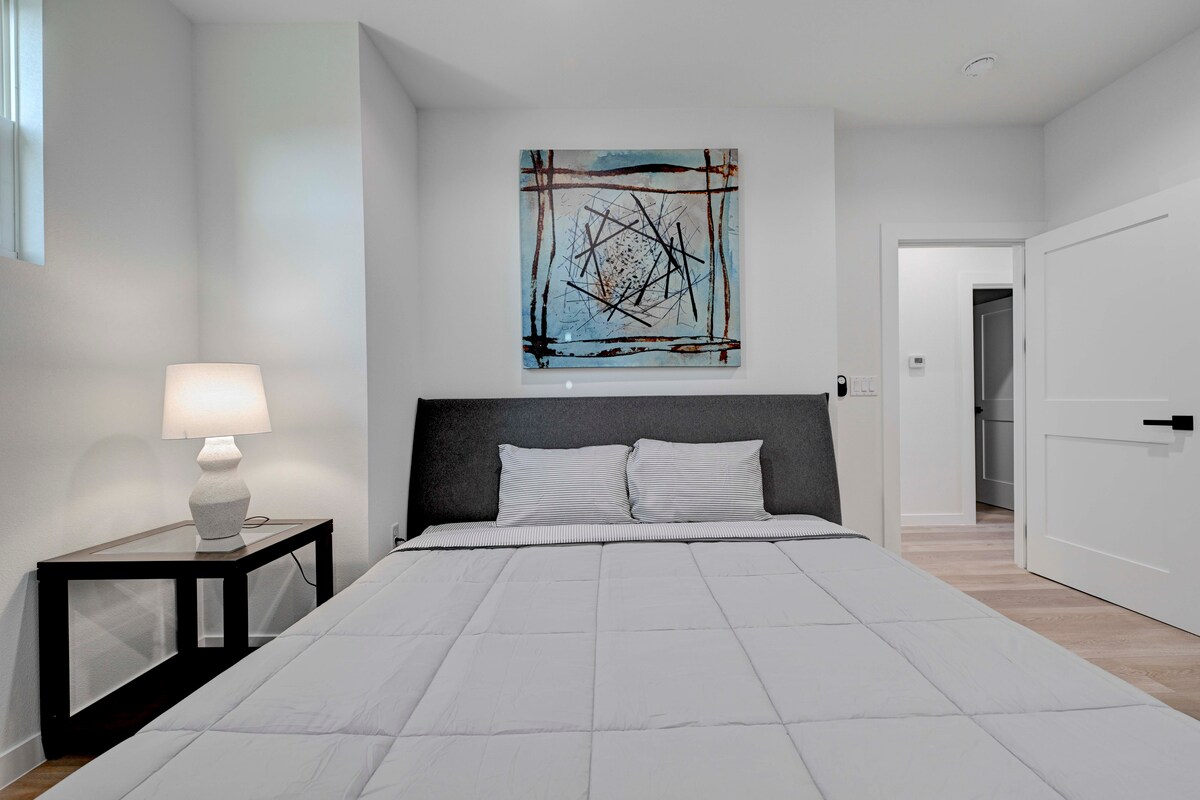 2220 Yellow Jacket Lane, Unit 1 Austin, TX 78741 - Photo 25 of 35 A tranquil bedroom retreat features clean lines and inviting warmth.