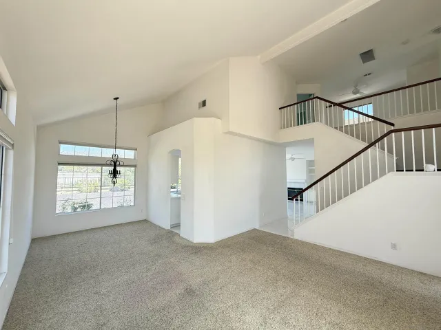 a view of an empty room with windows
