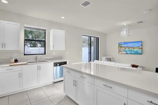 a kitchen with a sink and cabinets