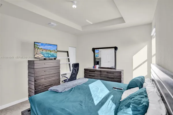 a bedroom with a bed and furniture