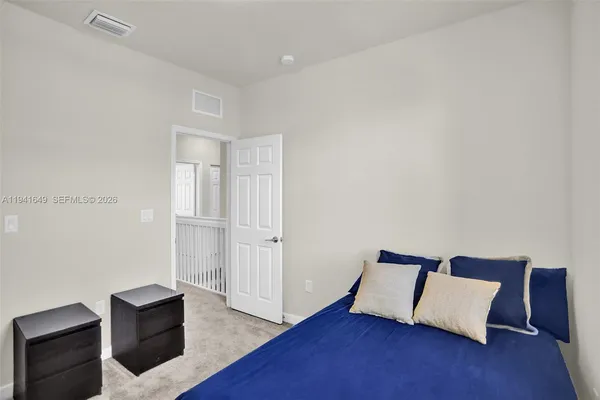 a room with a bed and a chair