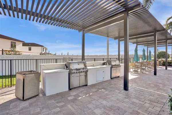 a view of a patio with a table and chairs
