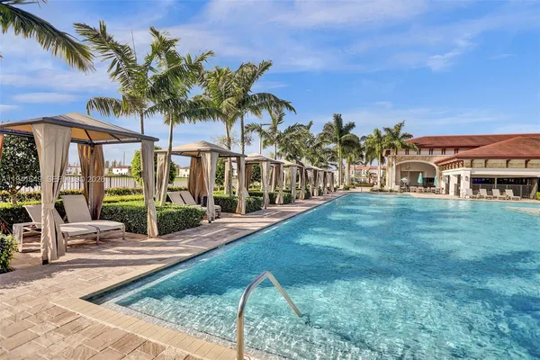 a view of a house with backyard porch and sitting area