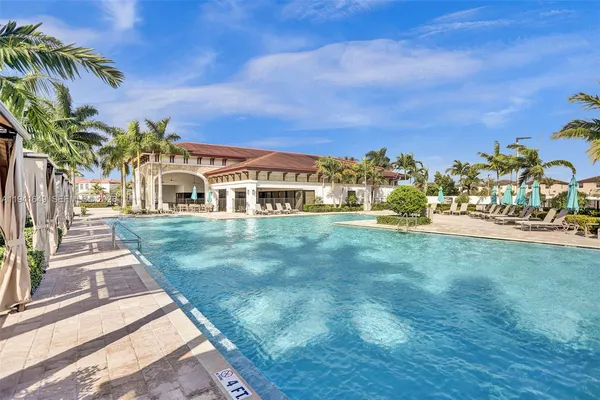 a view of a white house with a yard