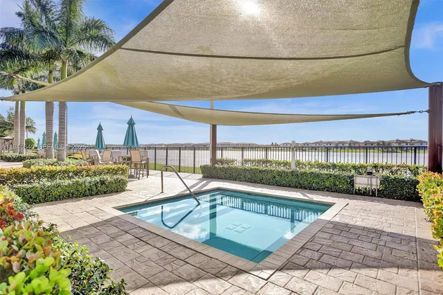 a view of a swimming pool with a lounge chairs