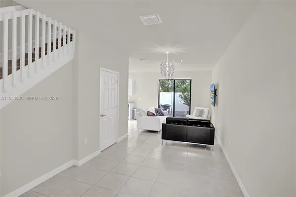 a hallway with a window and couch